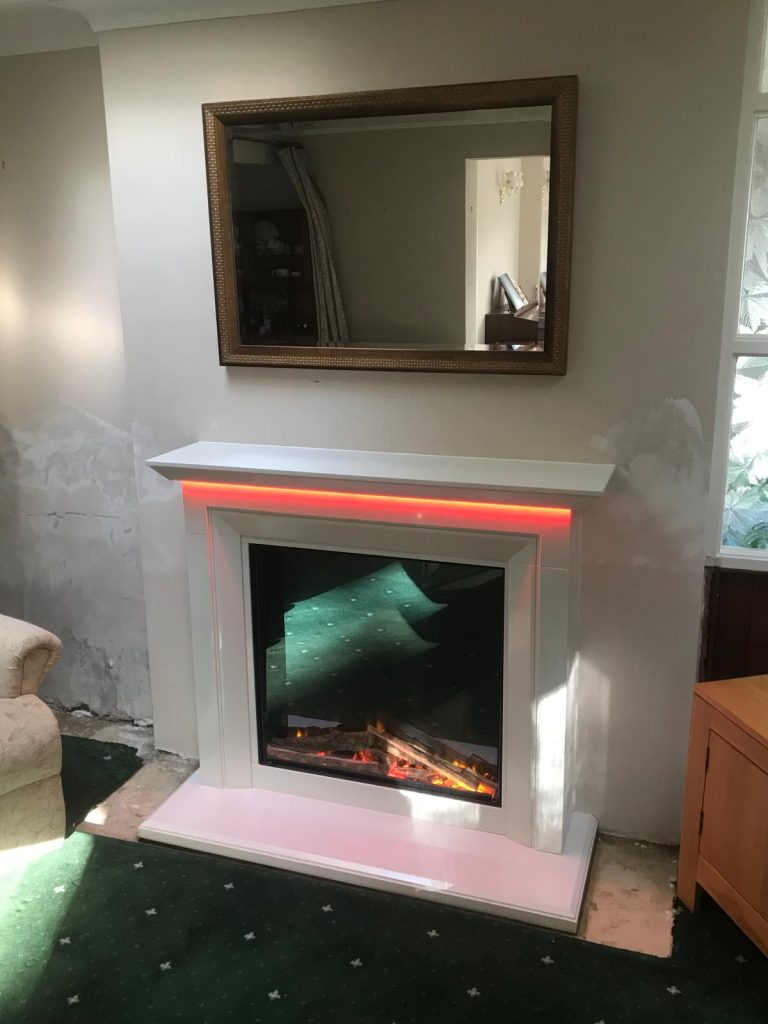 Electric fire in a contemporary surround with LED lighting, installed by Fire Flair Direct