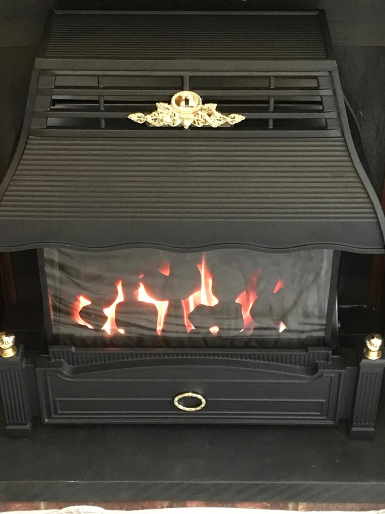 Traditional gas fire with canopy in a black fireplace, installed by Fire Flair Direct